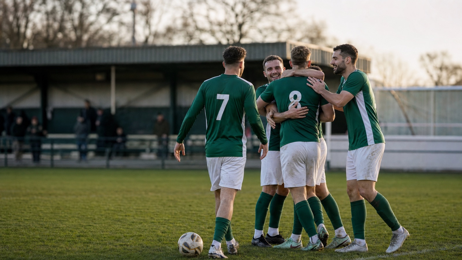 FC Boranders first-team players celebrate together after a home match